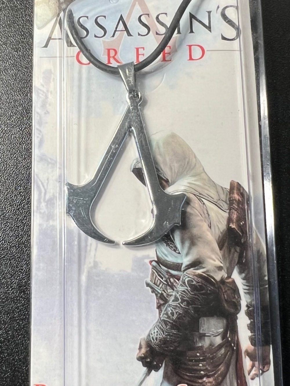 Official Licensed Assassins Creed Revelations Silver Tone Black Cord Necklace